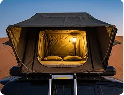 Roof tent open on a Mitsubishi Montero at dusk, Wahiba Sands, Oman